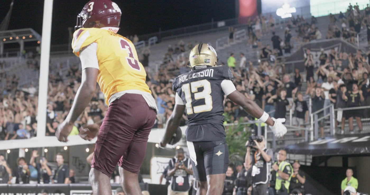 Two football players in the original touchdown clip